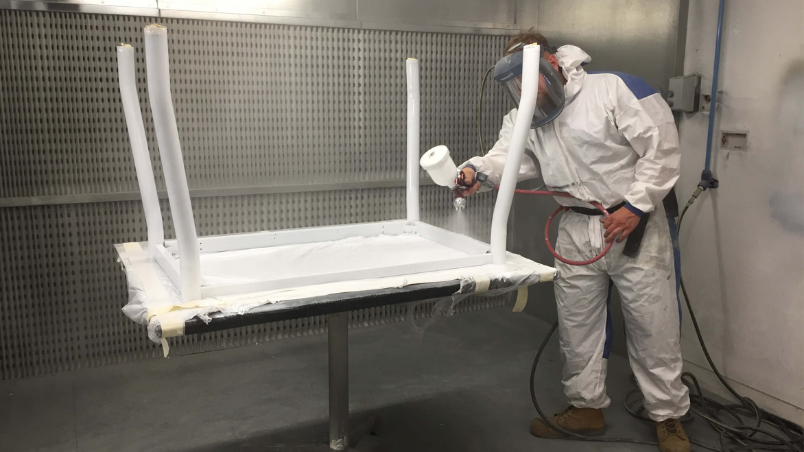 An example of furniture restoration desk spraying undertaken by Crown Workspace