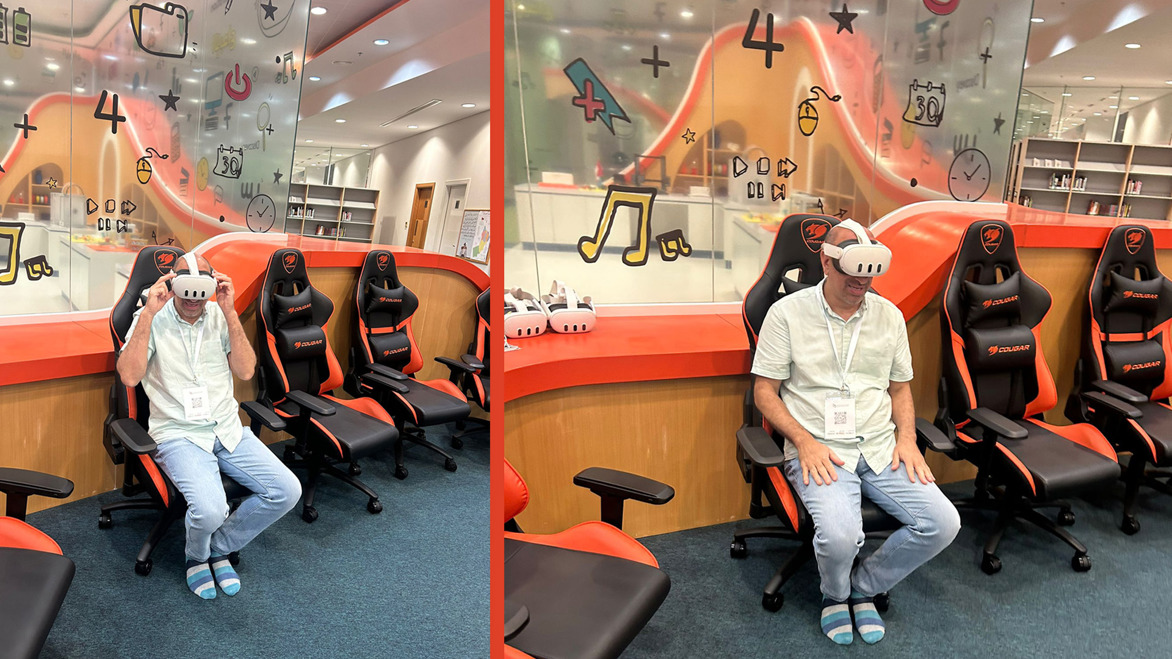 Ayub Khan in a Librar in Oman wearing a VR headset