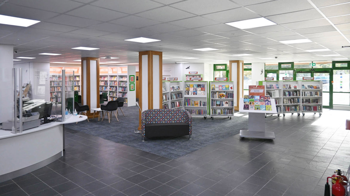 Llanrwst Library main floor area with bookshelves and reading areas