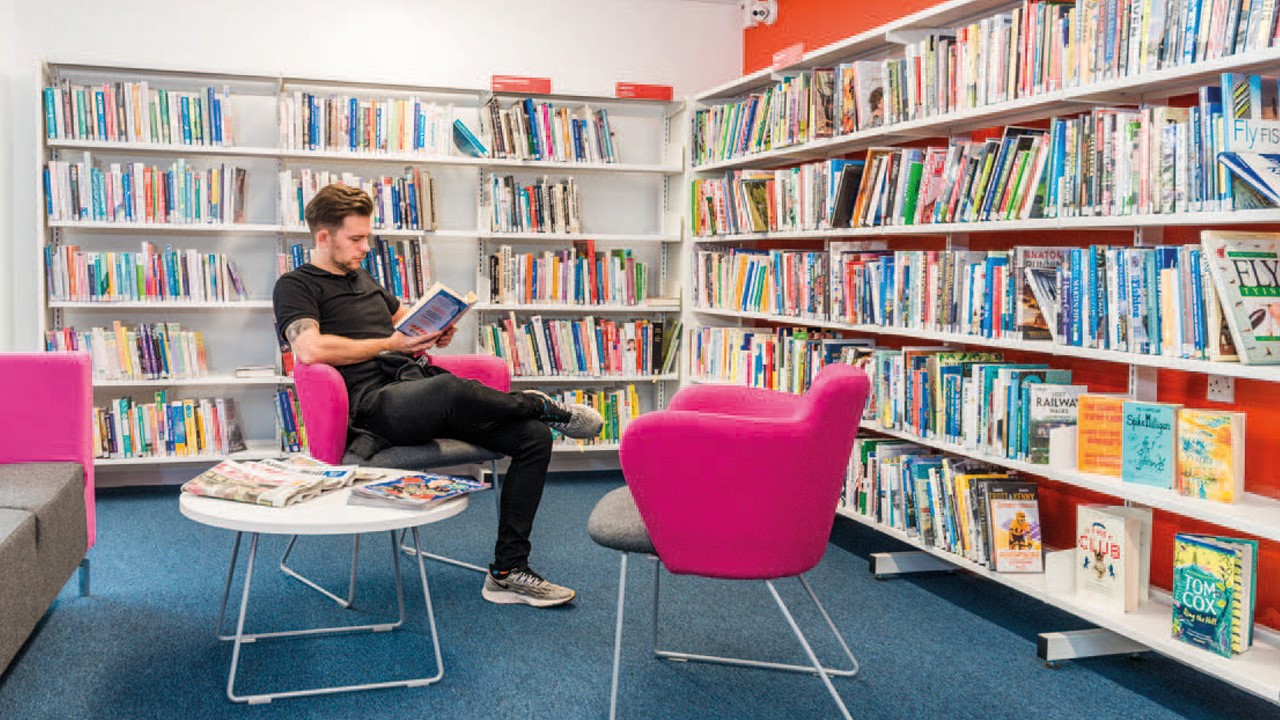 Man Readiing In Treorchy Library, Wales