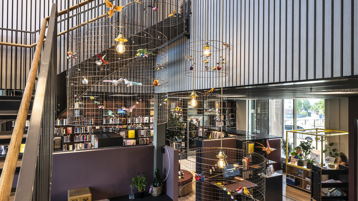 Skiptvet Public Library new interior design with lights in metal cages