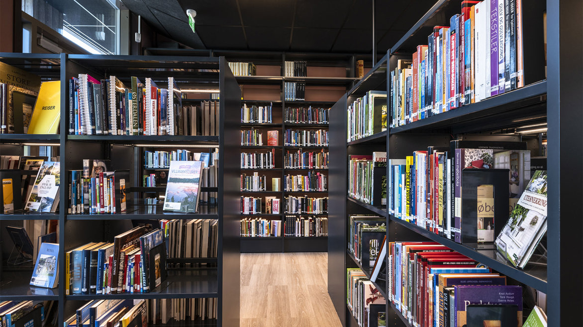 Skiptvet Public Library stylish interior with modern black book shelving