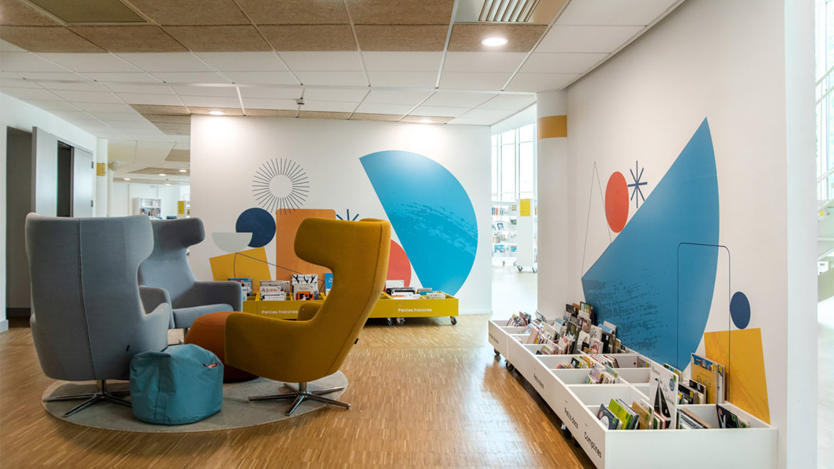 Bright seating area with comfortable chairs inside the library