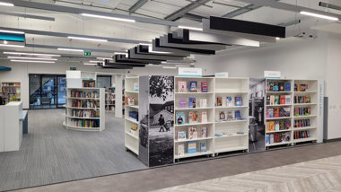 Large modern interior with spacious bookshelves inside this community library