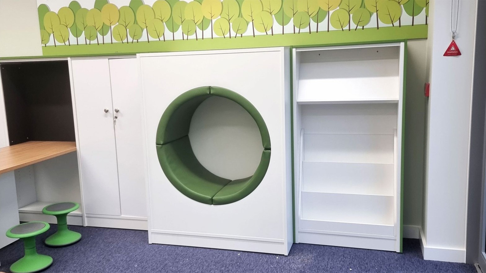 A photo of Hillbourne Primary School's new Library showing an open green seating area