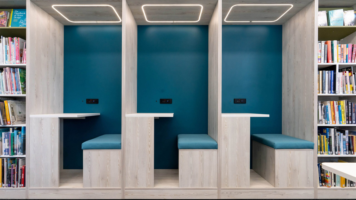 Blue and bright wooden cosy study booths inside the main library