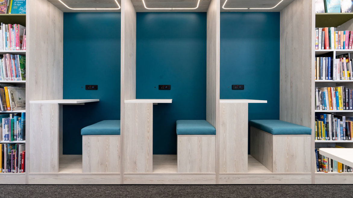 Blue and bright wooden cosy study booths inside the main library