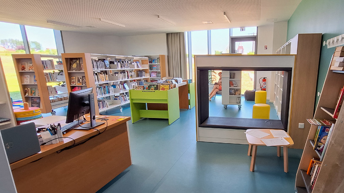 Raimbeaucourt Library in France, new bright shelving and reading booth