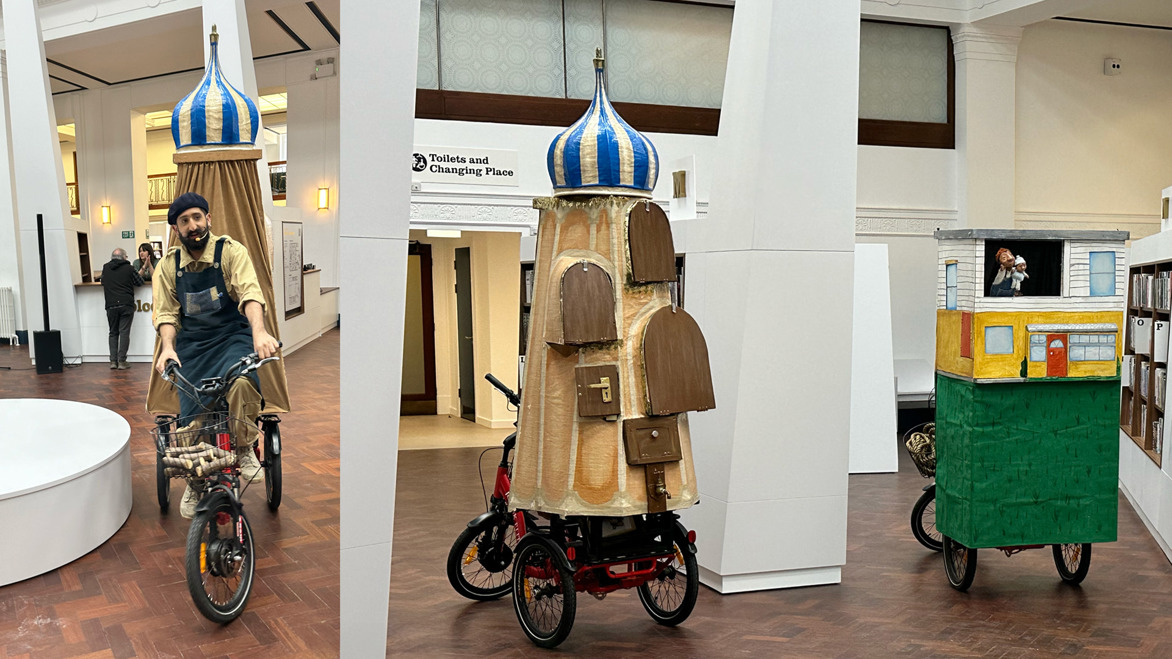 Puppet show on bicycles in the atrium of Bolton's new central library