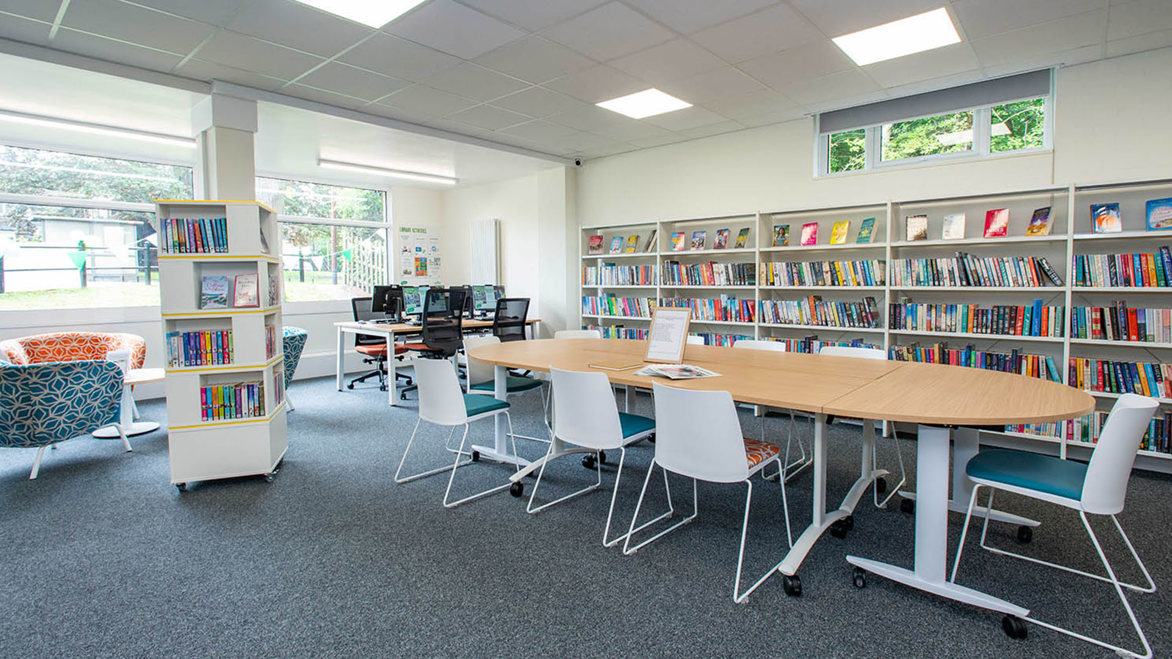 Spacious area for a wooden table and bookshelves in St Pauls Cray Library, Bromley