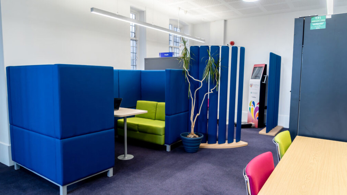 Bridlington Library Health Hub with private blue hubs with soft green sofas in them
