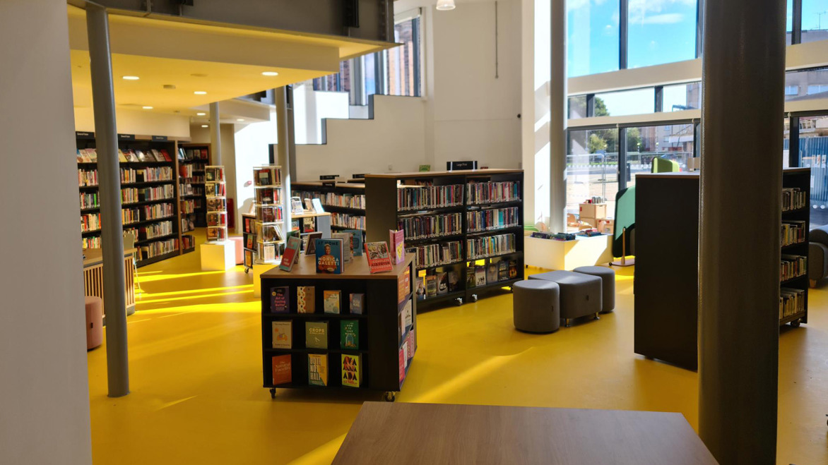 Macmillan Hub Library interior bookshelves with spacious areas to sit and read in