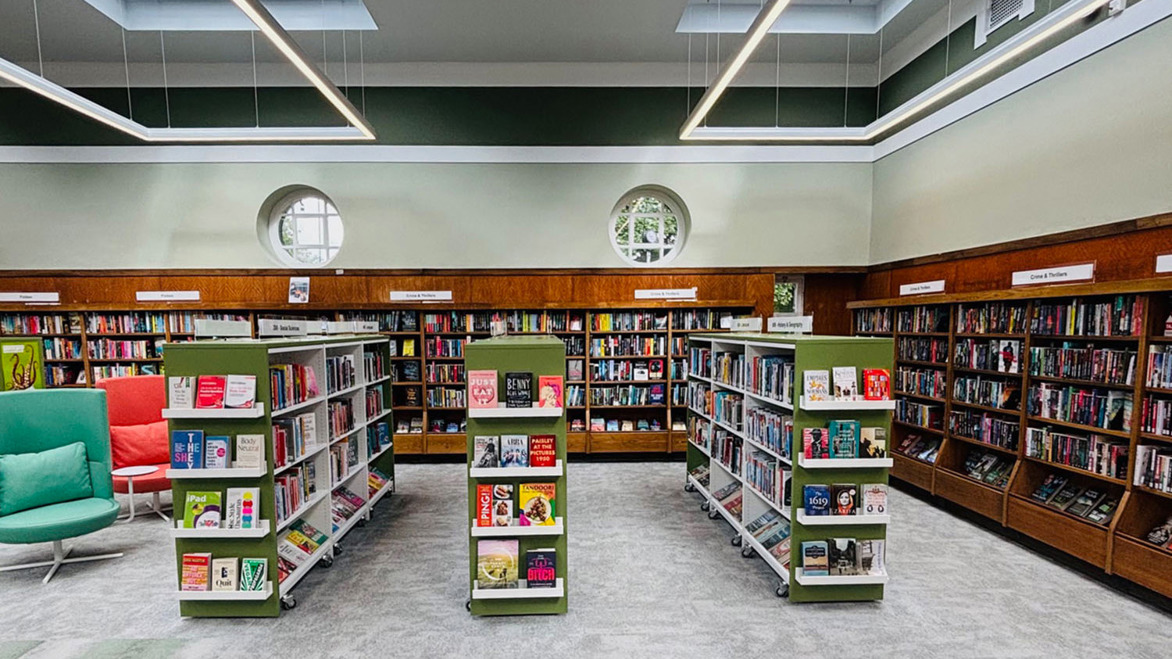 Elder Park Library interior with green and brown spacious bookshelves area