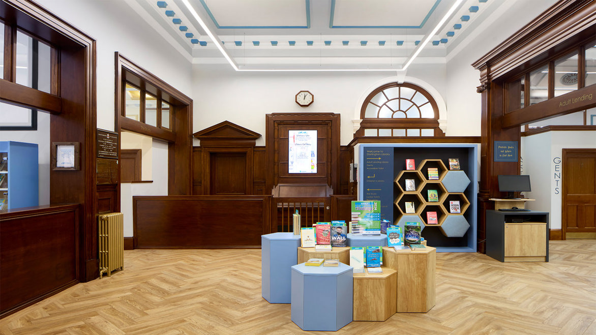 Darlington Library bright interior colourful octagonal shaped book displays